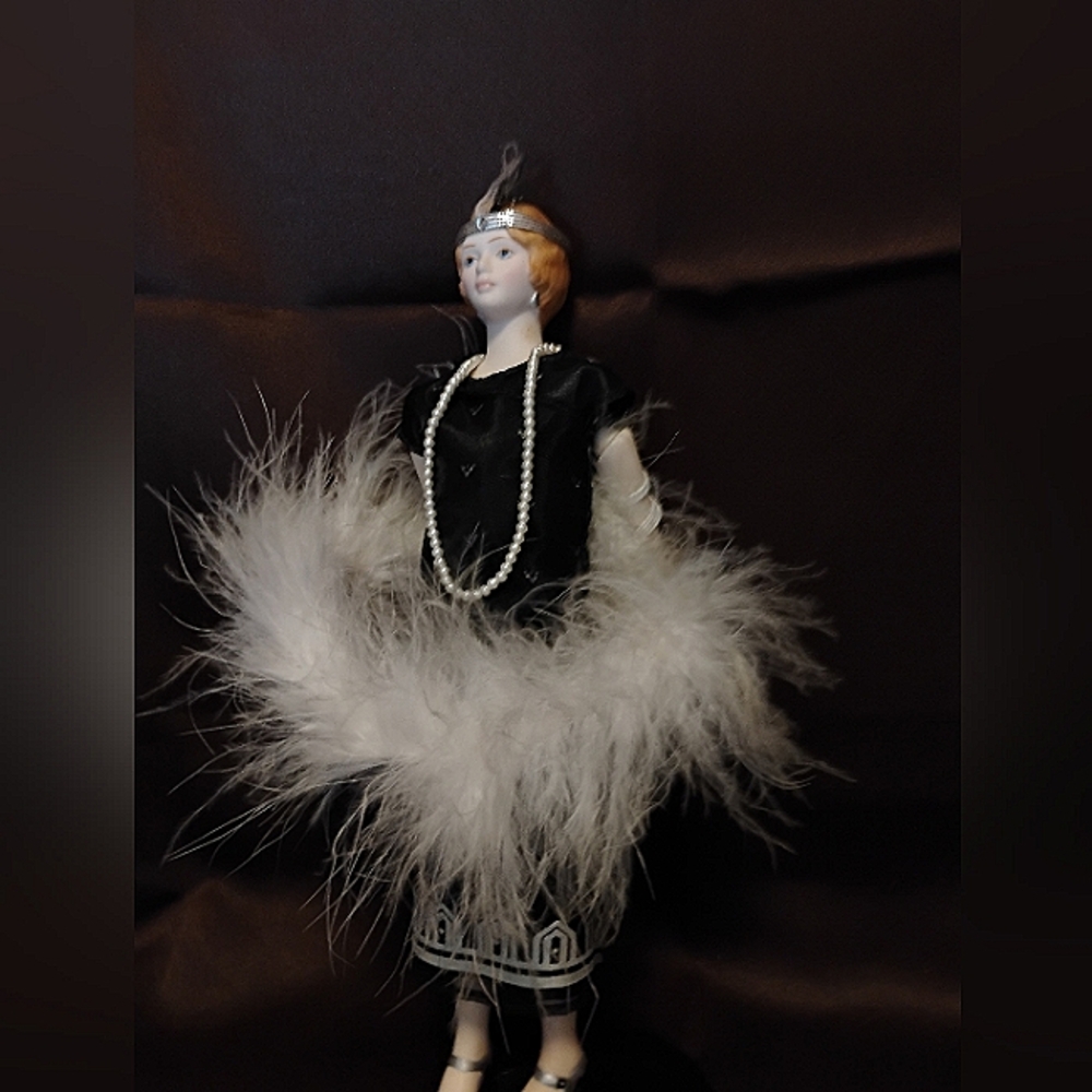 Vintage Porcelain Doll with Feathered Dress